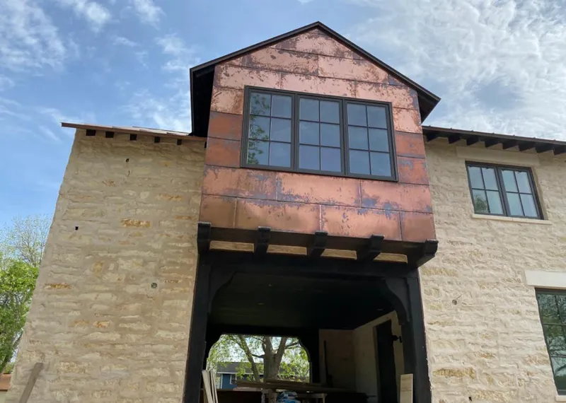 Copper metal panel facade on a stone building for Metal Roof Coating in Saratoga Springs